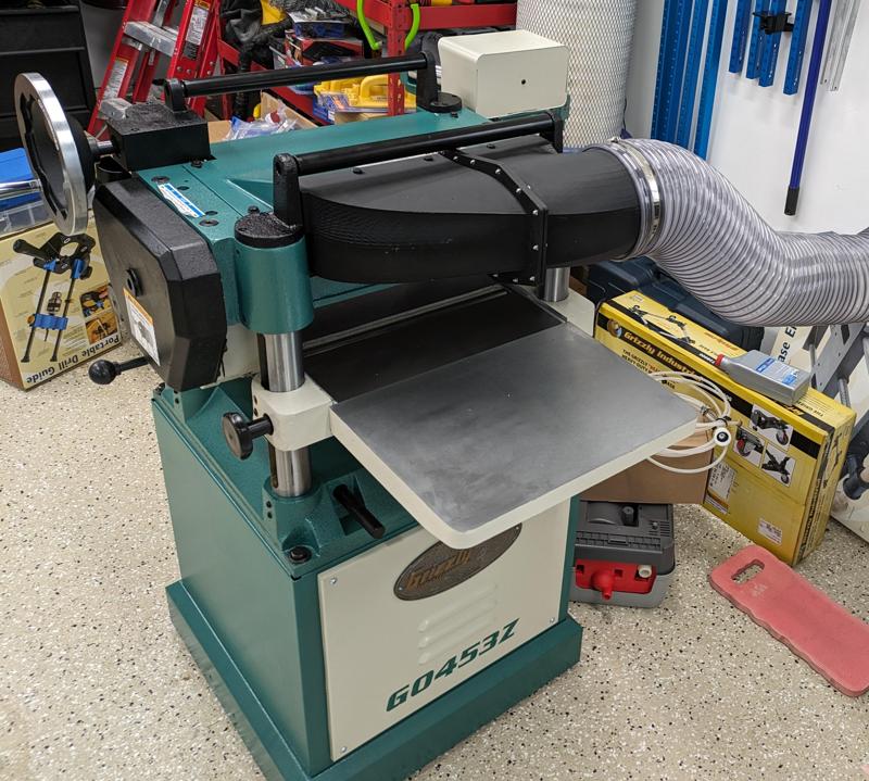 Upgraded dust port for Grizzly G0453E planner.