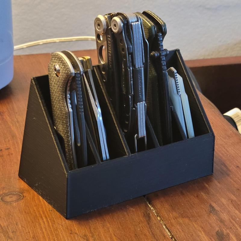 Desktop beside organizer display stand for pocket knives or other