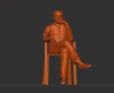 male sitting on chair