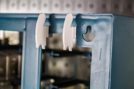 Clips for Hanging Storage Cabinets on Wall Control Slotted Metal Pegboards