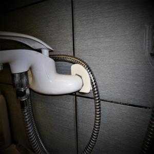Shower hose holder