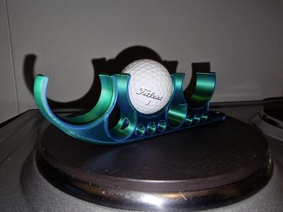 Golf ball and tee holder