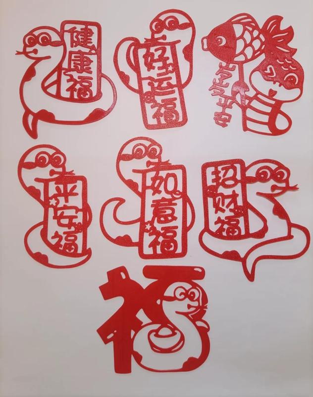 Several designs of Year of the Snake window decorations and paper-cut stickers