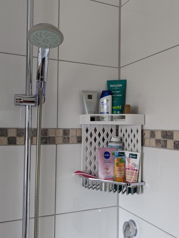 Shower shelf extender