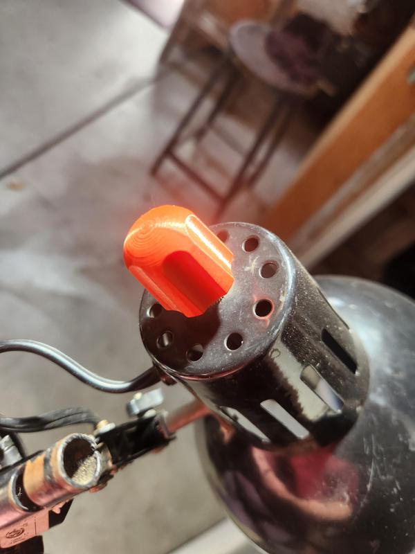 Ergonomic switch knob for swing-arm lamps