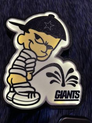 Dallas cowboys fan boy peeing in a giants logo