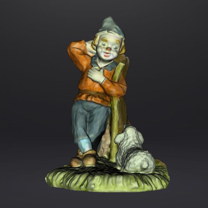 Clown brebis contre un arbre