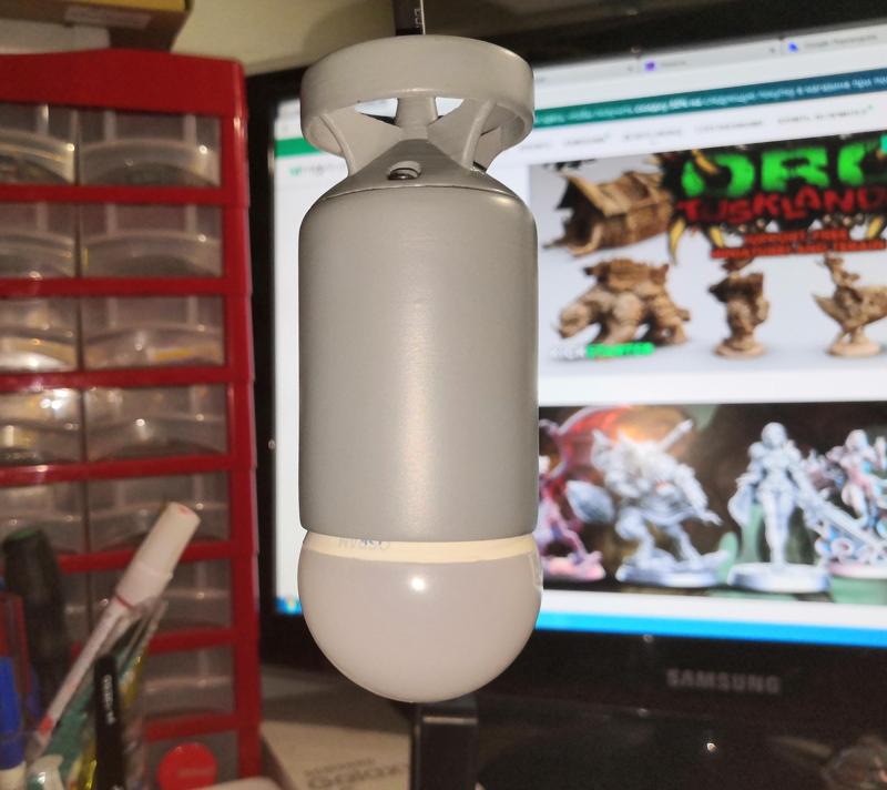 Holder for LED lamp with E14 base, in the form of a sea torpedo.