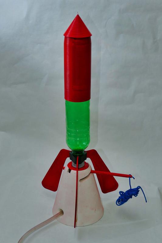 Adapter and fins for a soda-bottle-type water rocket