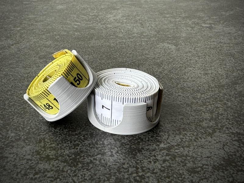 Sewing tape measure holder