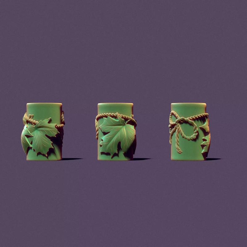 Autumn candle with maple leaves