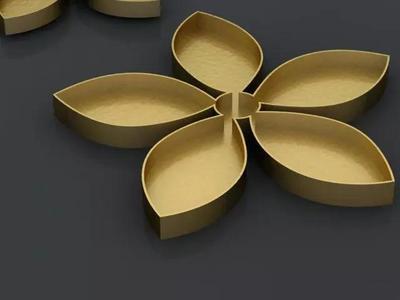 cutterd three golden flower shaped plates