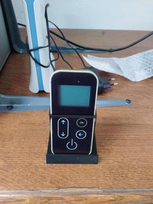 Remote control or handheld holder for pellet stove
