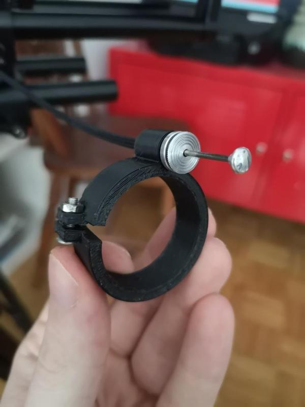 Cable release clamp for shoulder rig handles