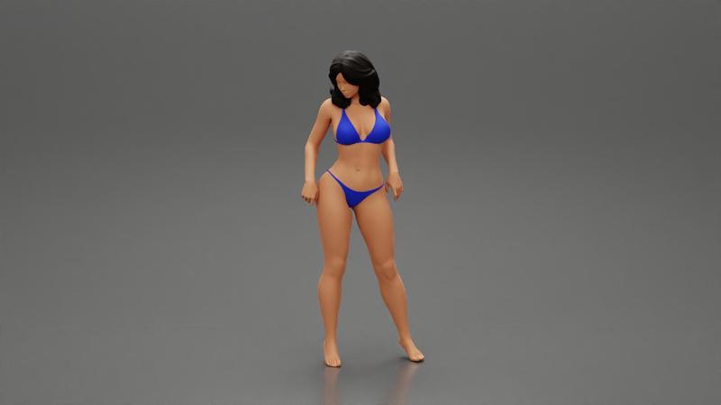 sexy girl in bikini posing standing on the beach