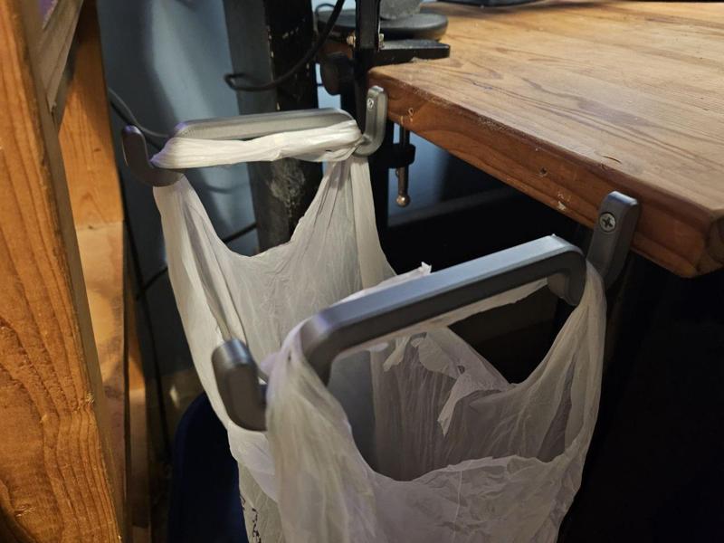 Grocery store bag hooks for using as a trash bin