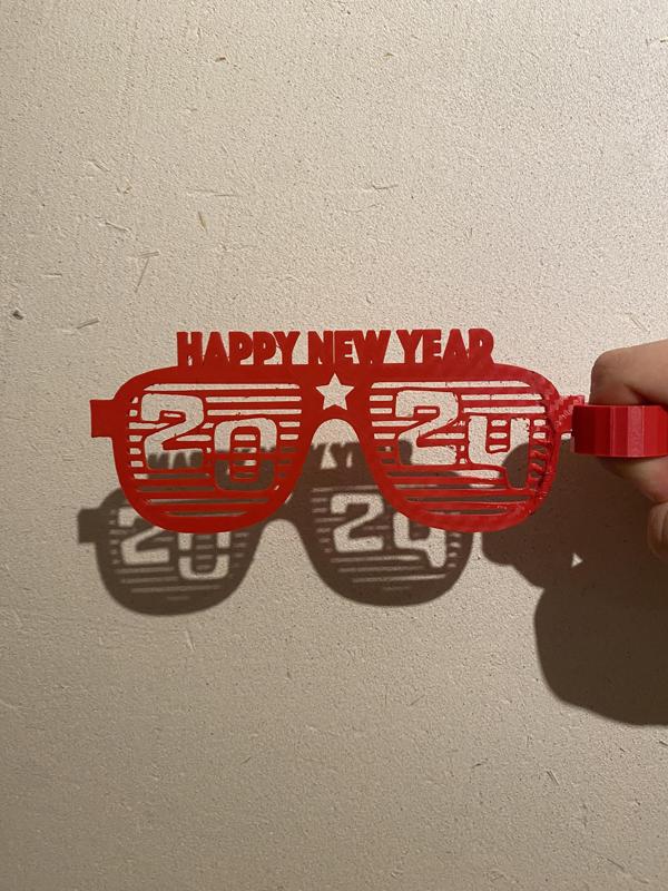 2024 New year finger held glasses
