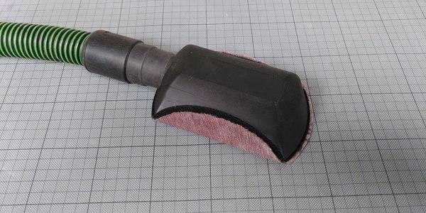 Vacuum-assisted hand sanding block (Mirka sanding grid)