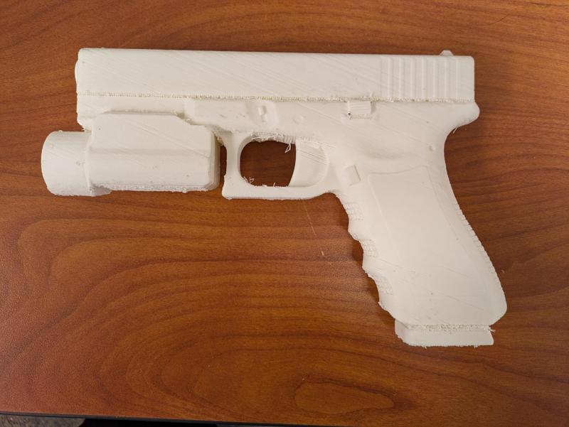 prop gun with tactical light