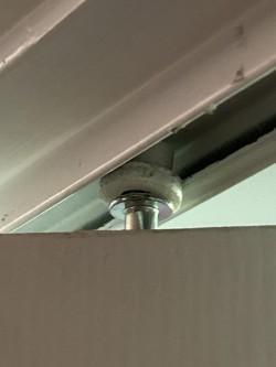 Bifold door pin roller