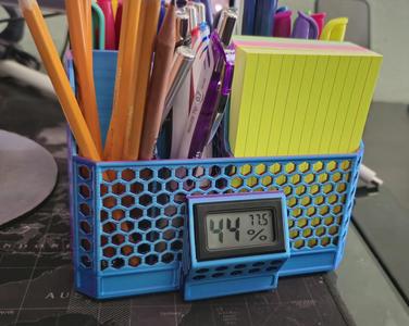 Desk organizer with temperature and humidity monitor, fits index cards.