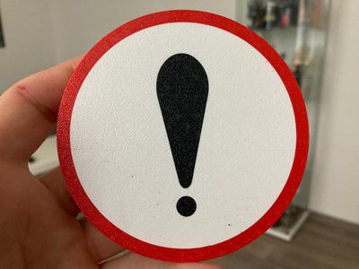 Circle warning sign coaster