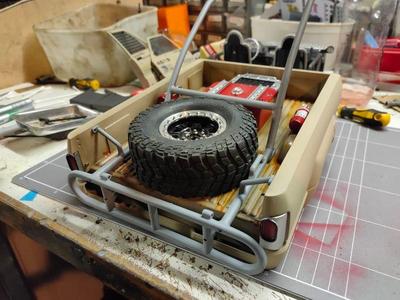 bed mounted spare tyre holder