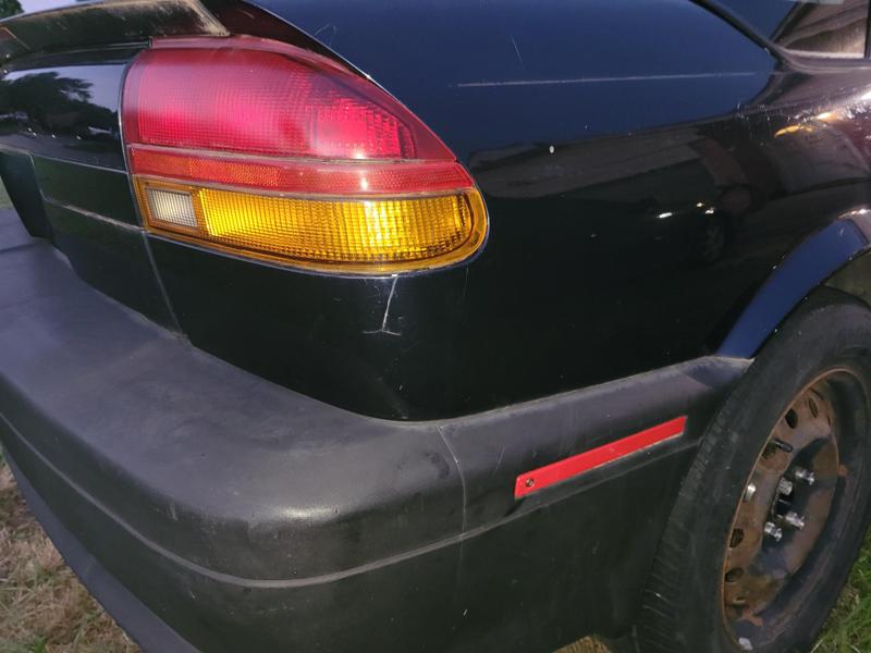 91-95 Saturn SL1 rear bumper red reflector