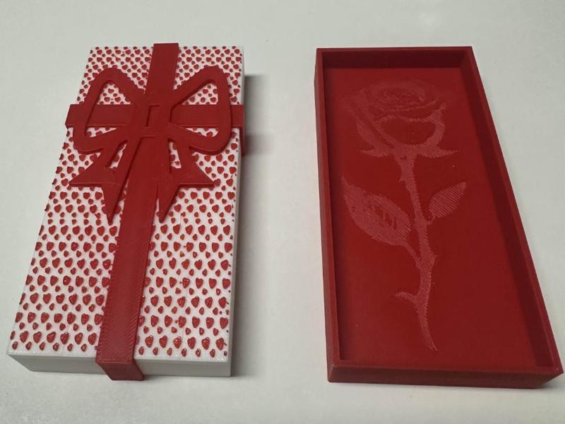 Gift box with ribbon and heart pattern