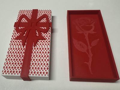 Gift box with ribbon and heart pattern