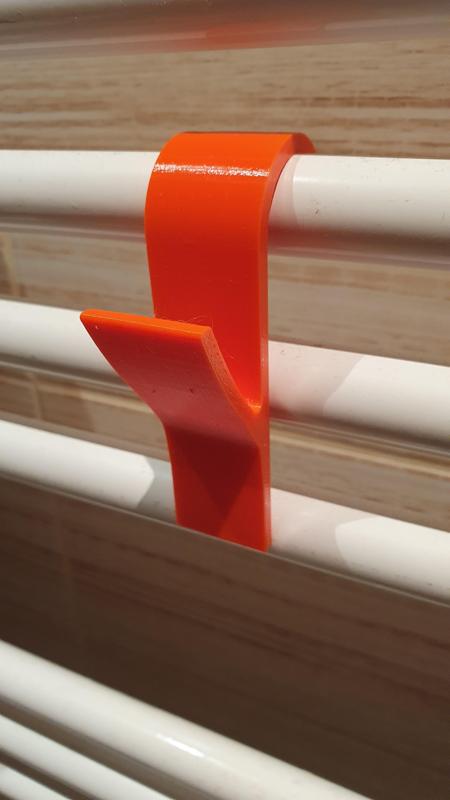 Věšák na topení, Peg on heater