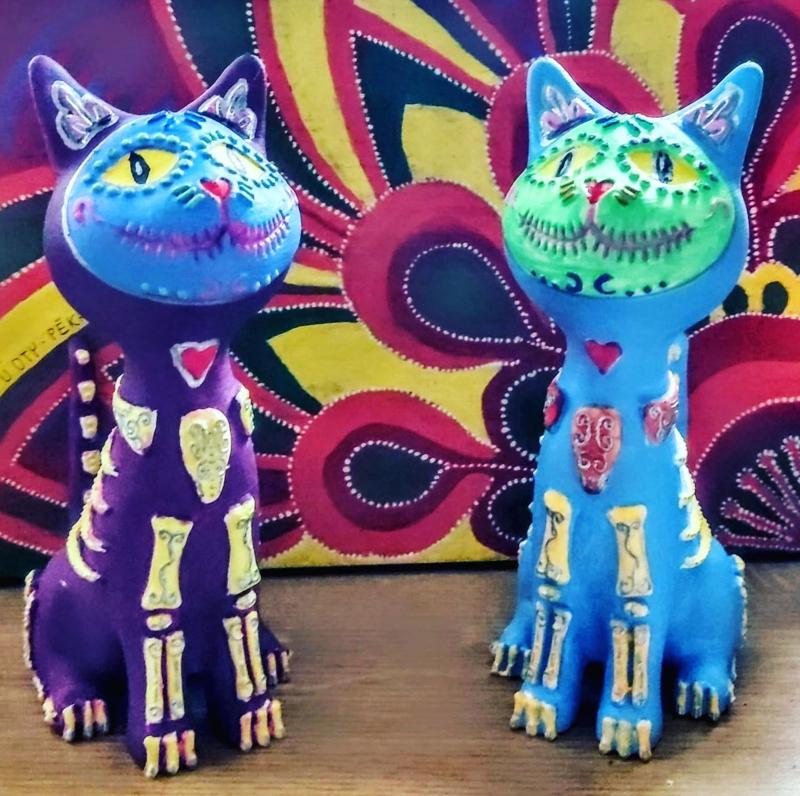 Sitting cat with drawings on it