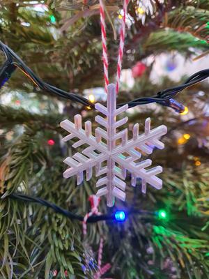 Snowflake shaped christmas tree ornament