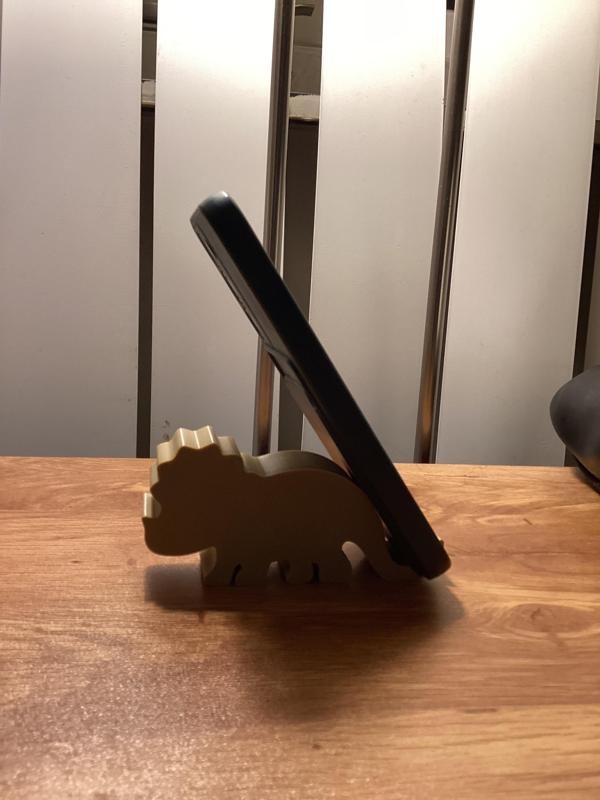 Dinosaur-shaped cell phone holder or holder