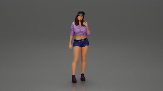 Sexy girl in a cap, mini shirt, and shorts, waiting for someone