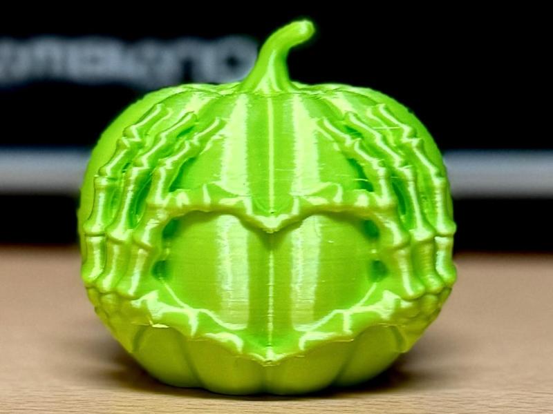 Small heart pumpkin with skeleton hands