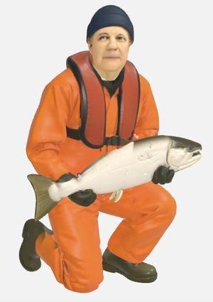 Fisherman kneeling with trout type 11