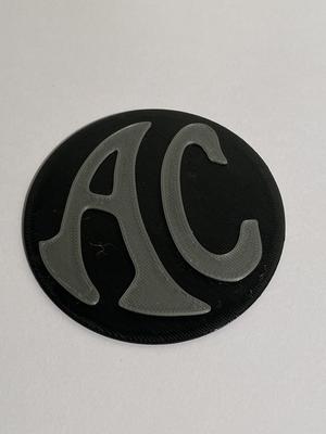 AC car badge for wheel chock