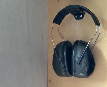 Ear protection holder for tool wall mounting