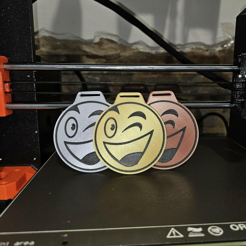 children's medal with a smiley face