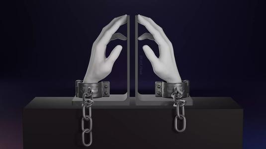 Hand in shackles bookend