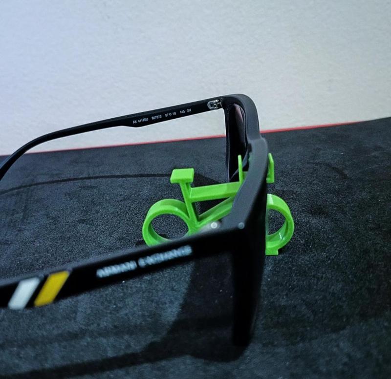 Stand for glasses, in the shape of a bicycle