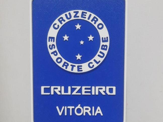 Cruzeiro shield plate with person's name on the model