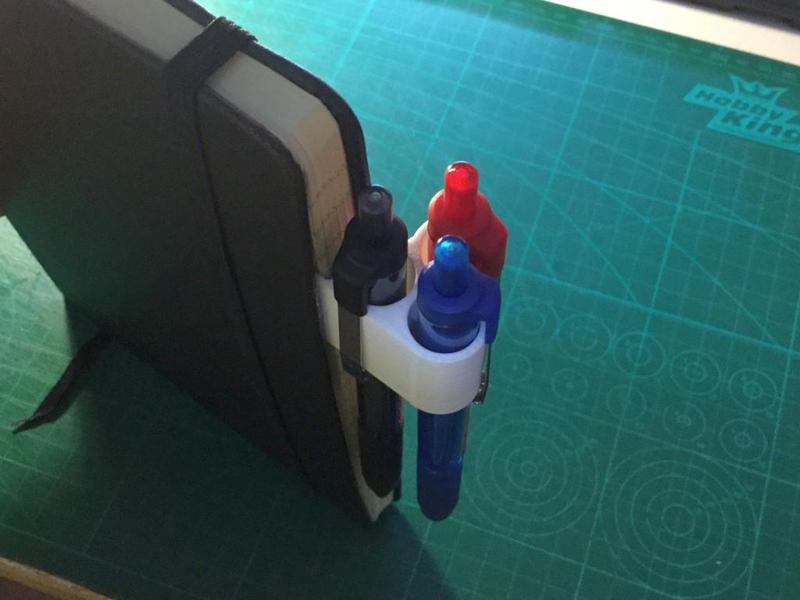 Stick-on pen holders for journals, diaries, and planners