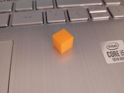 Test cube with raised letter