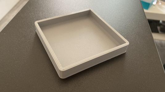 Coaster for a glass with ice