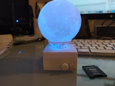 Illuminated rotating sphere stand