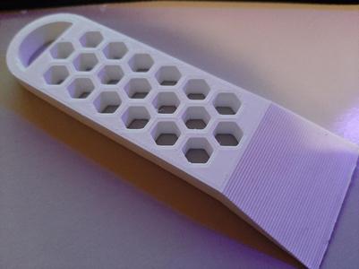 Scraper With Hexagonal Design