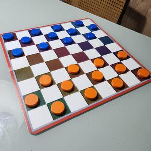 Checker piece (Damas)