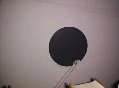 Plate for round electrical box (wall cavity) with hole for cable